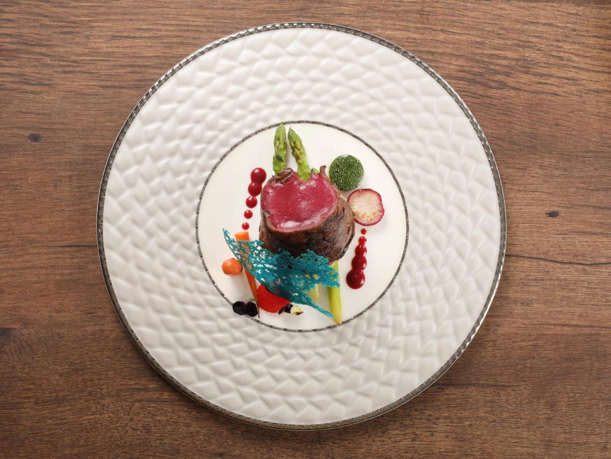 Peridot Grand Luxury Boutique Hotel Hanoi Exterior photo A plate of food