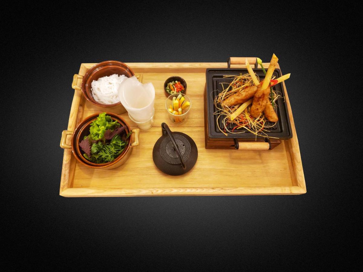 Peridot Grand Luxury Boutique Hotel Hanoi Exterior photo A bamboo serving tray